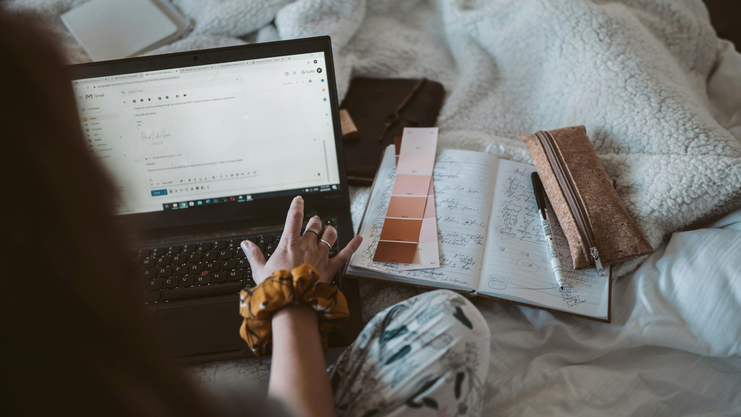 Woman typing on a laptop visualizing: 'how to send cold emails for sponsorships'